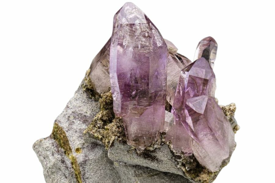 A beautiful amethyst crystal cluster with a rock mineral