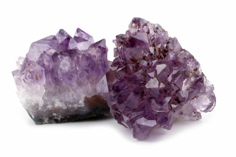 Two pieces of amethyst geodes with an irregular shape