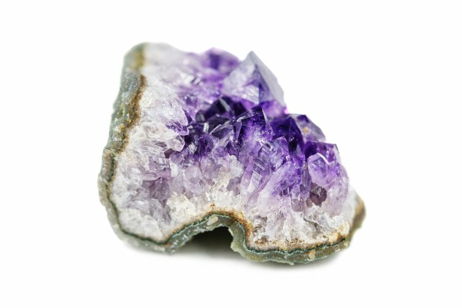 An amethyst geode with an irrregular shape cracked open