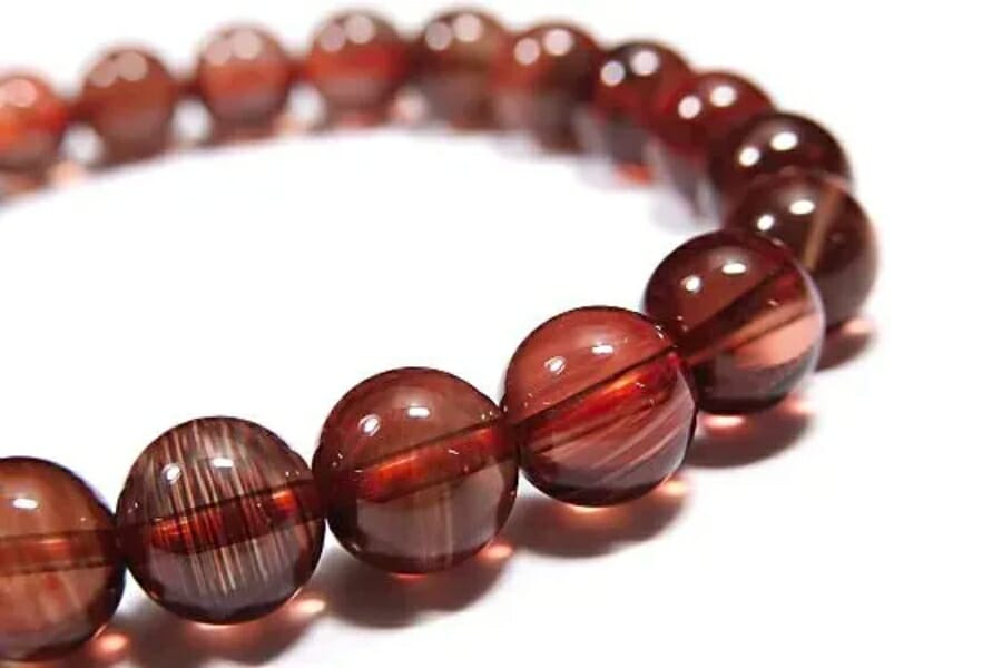 A bracelet made out of red Andesine beads
