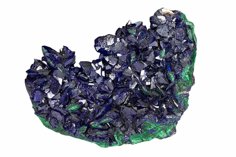 A rare azurite crystal with a dark blue color and parts that are green
