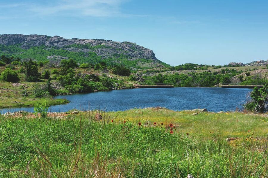Caddo Mountains with a lake at its foot and grasslands surrounding it