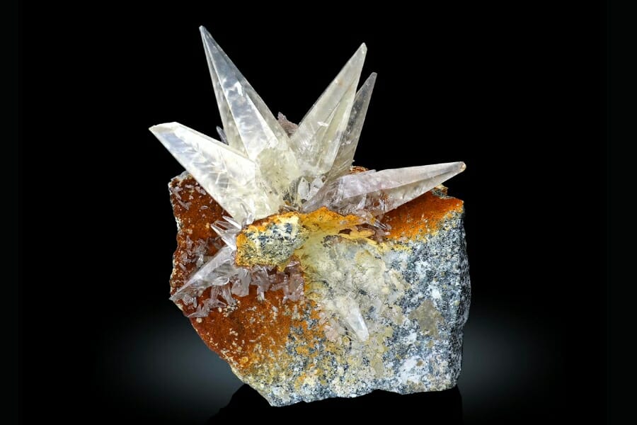 White Calcite on matrix atop a rock