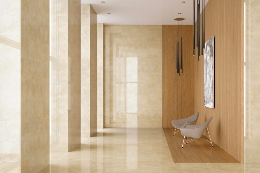 Cream-colored Crema Marfil with small yellowish-brown veins used as flooring and pillar tiles