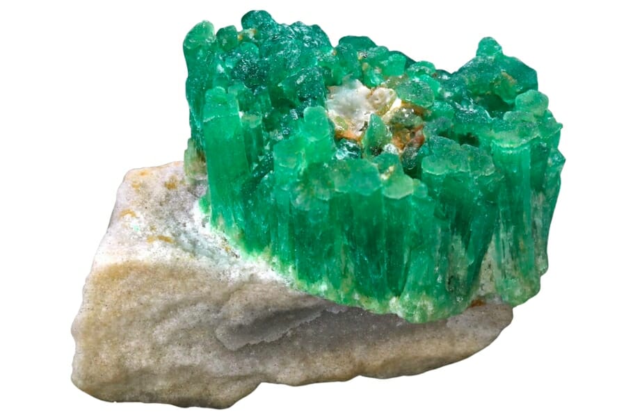 Bright green Emerald crystals on white Feldspar