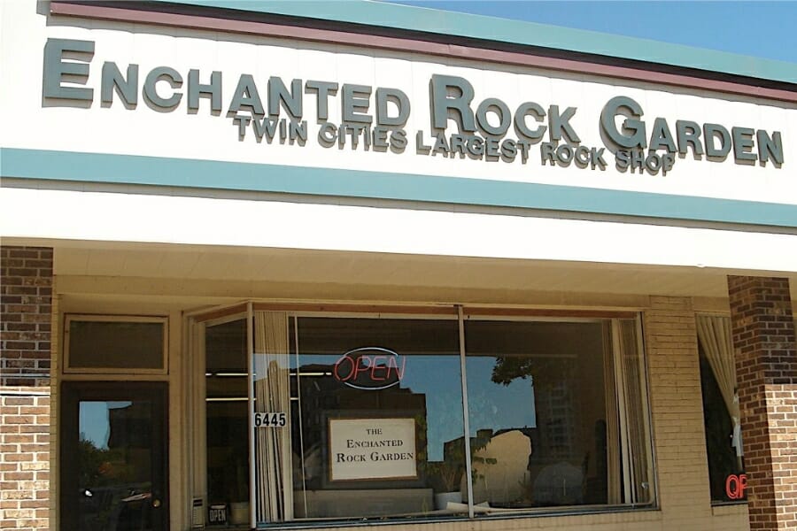 A look at the front store window and store name of Enchanted Rock Garden