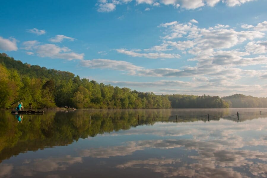 A serene view of the waters and surrounding trees of Fairy Stone State Park