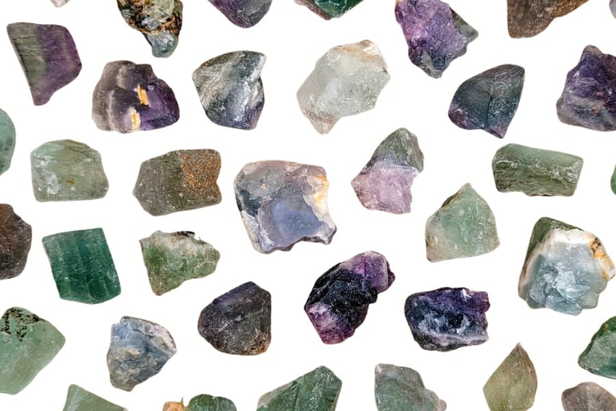 Many pieces of differently-colored and shaped raw Fluorite