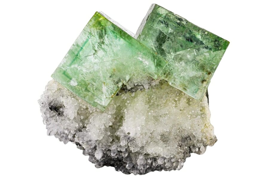 Light green Fluorite cubic crystals on white Quartz