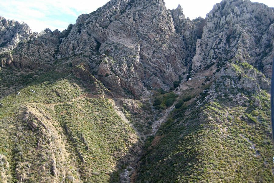 A scenic view of the Four Peaks Amethyst Mine mountain ranges with lush greens