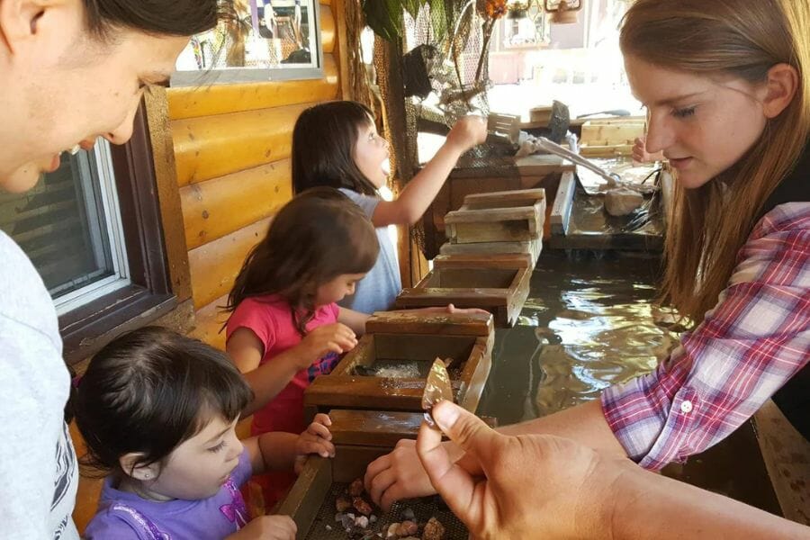 Kids panning for minerals at the Gold Rush Mining Company Adventures