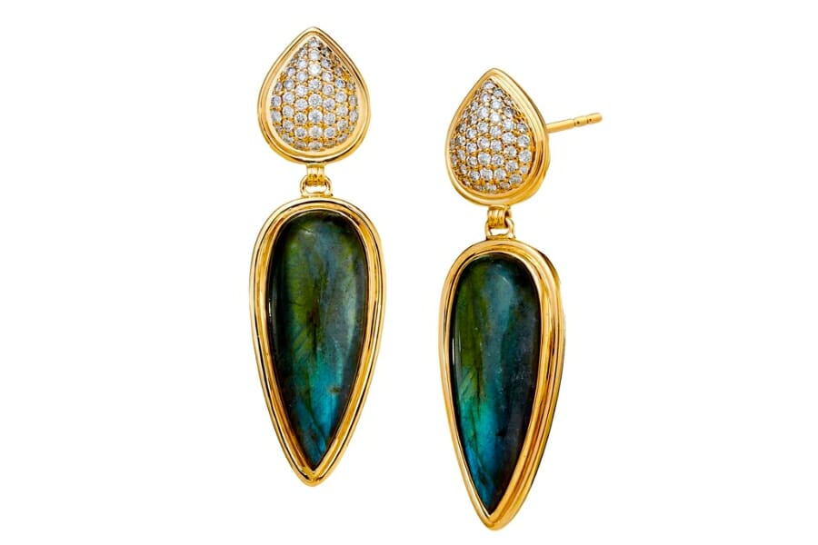 A pair of gold drop earrings with dark bluish-green Labradorite