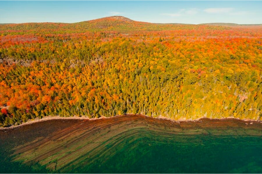 An aerial view of the stunning spring trees and landscape of the Keweenaw Peninsula