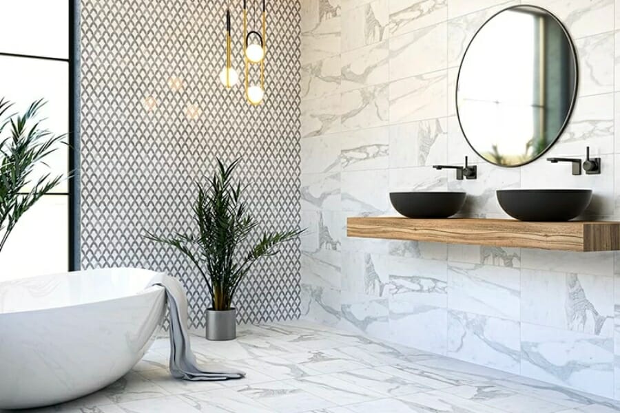 A bathroom with Marble flooring and tiles as walls