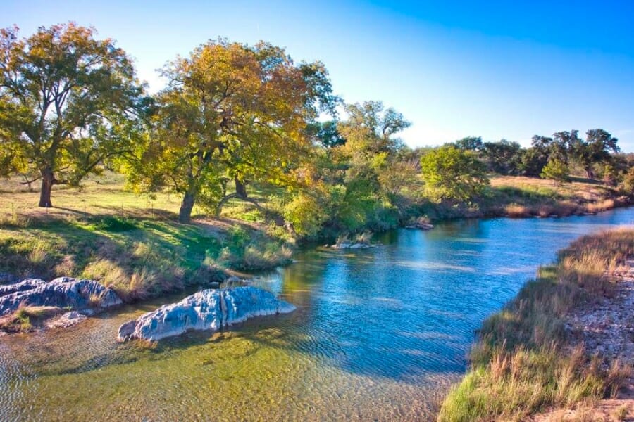 Picturesque view of a creek in the middle of a ranch in Mason