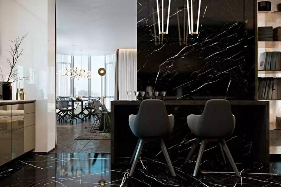Black Nero Marquina Marble with white veins used as kitchen flooring, countertop, and wall