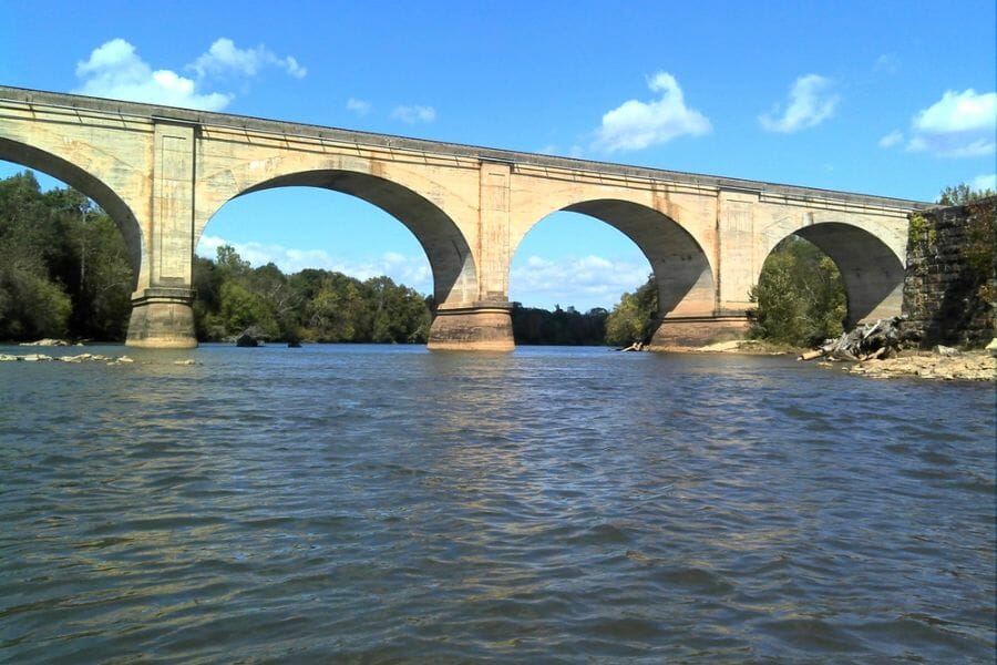Calm waters of Bowens River under the bridge