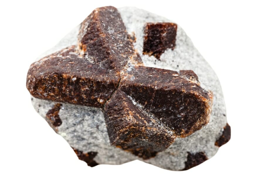 A piece of Staurolite displaying a brown cross detail in the center