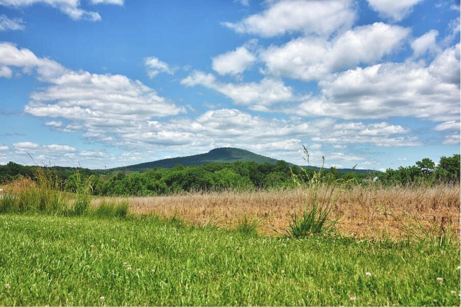 A nice serene view of the Sugarloaf Mountain under blue skies