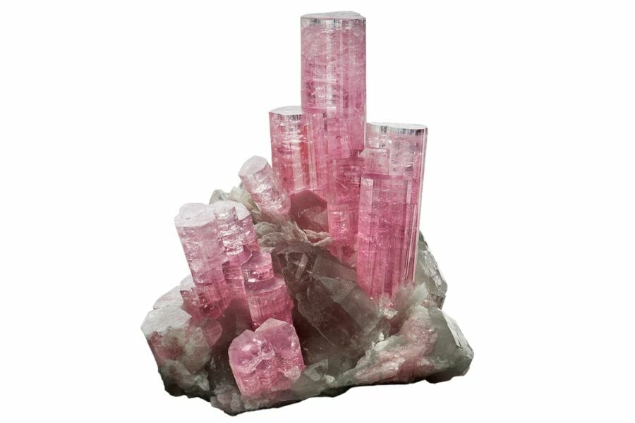 A majestic pink tourmaline crystal towers