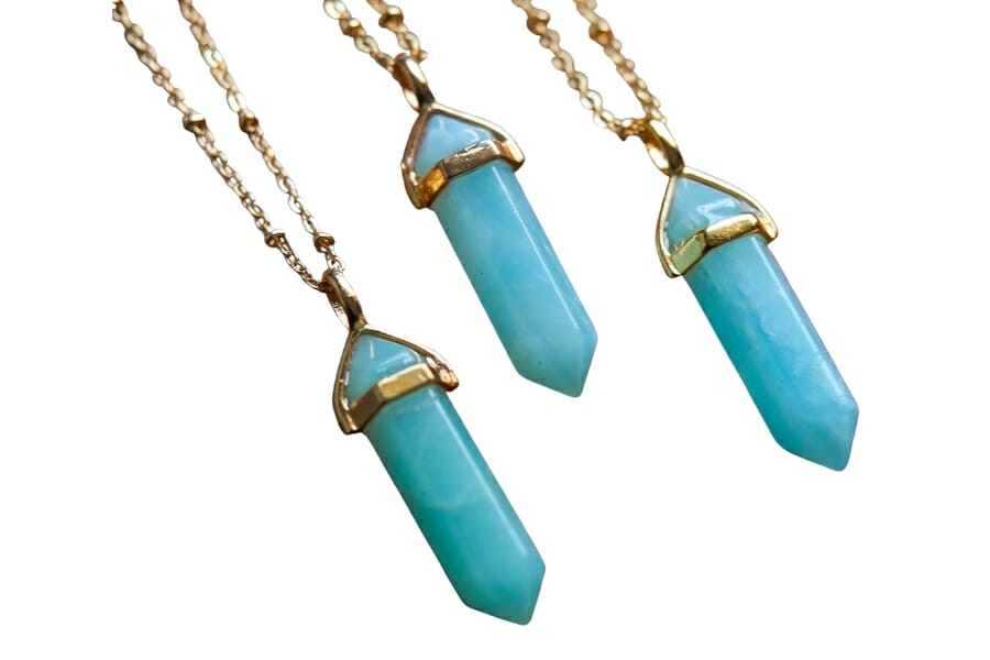 Three pieces of bluish green Amazonite pendants set on gold lace
