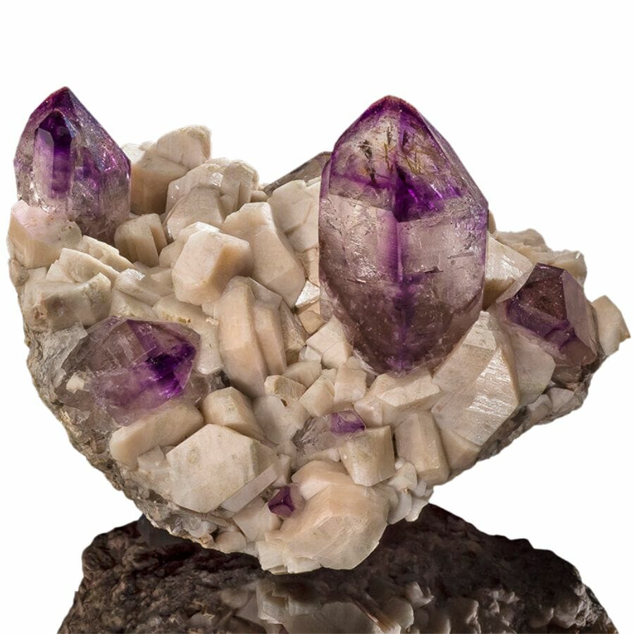 An elegant amethyst crystal on another mineral