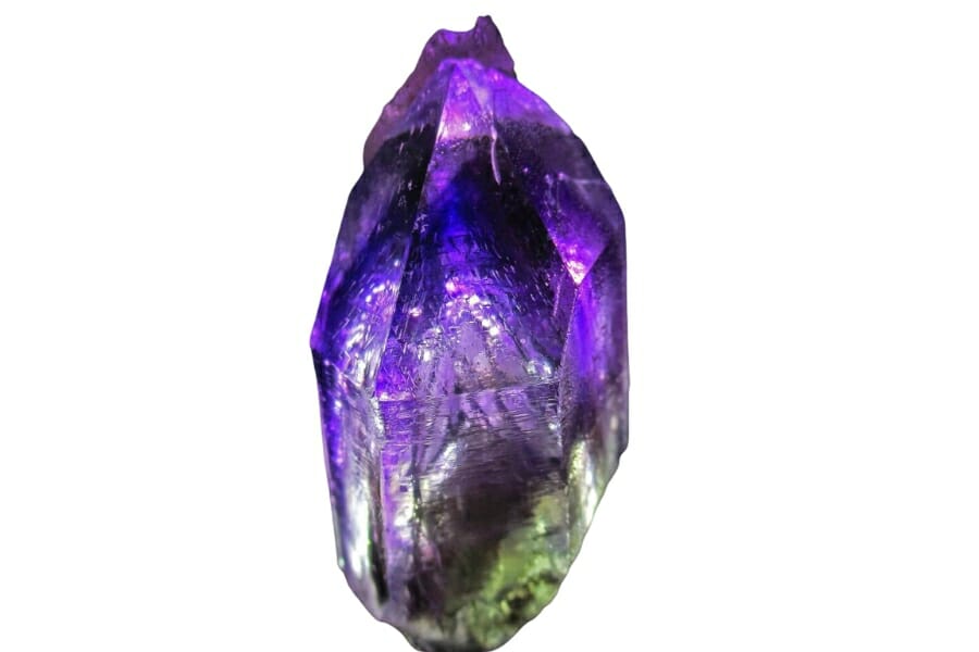 A stunning Amethyst crystal with deep purple, bluish violet, and even light green hues