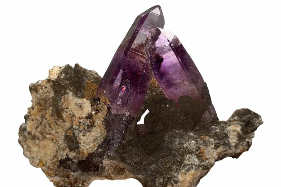Two gorgeous amethyst crystal towers on a pretty rock