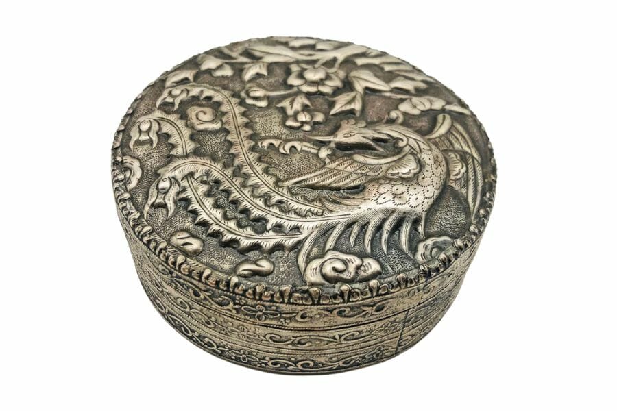 A beautiful antique Japanese dynasty circular antimony box with dragon designs