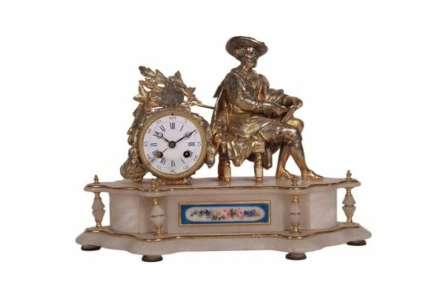 A luxurious vintage gilded antimony alabaster clock