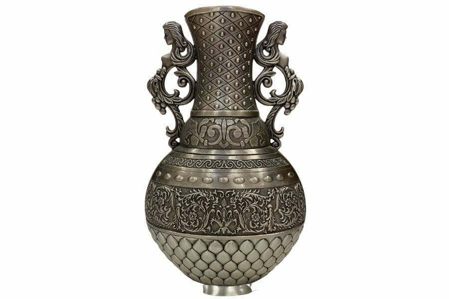 An elegant antique antimony vase with fine details