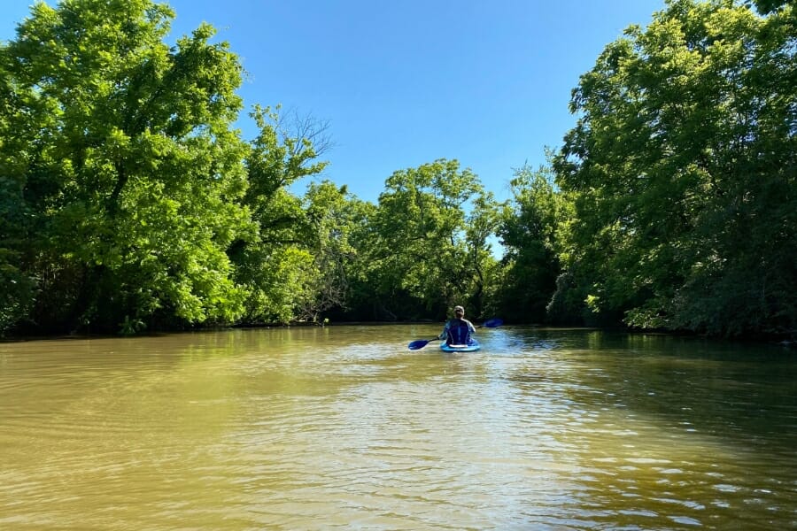 Bluff Creek area in Ashland with a man kayaking