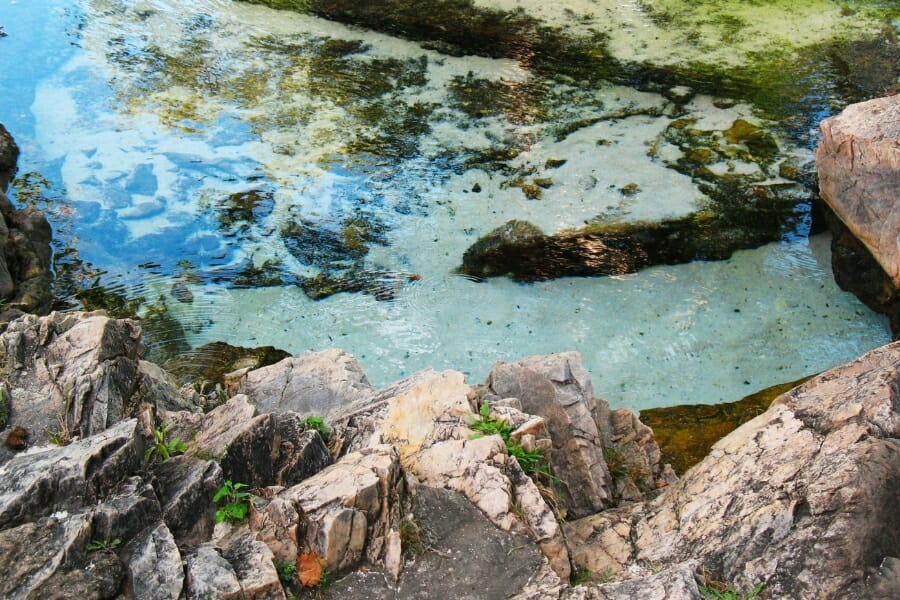 Close up look at the clear waters and intricate rock formation at Berkeley Springs