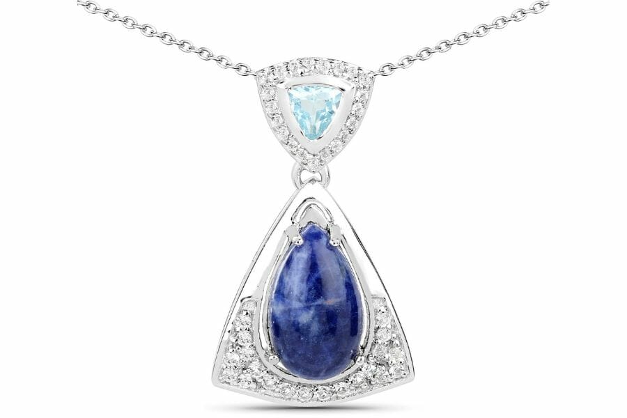 A dazzling blue aventurine necklace with two pendants and diamond crystals around them