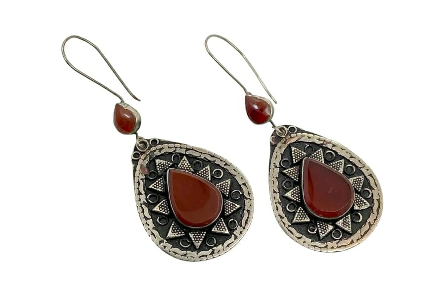 A pair of earrings adorned by Brown Carnelians