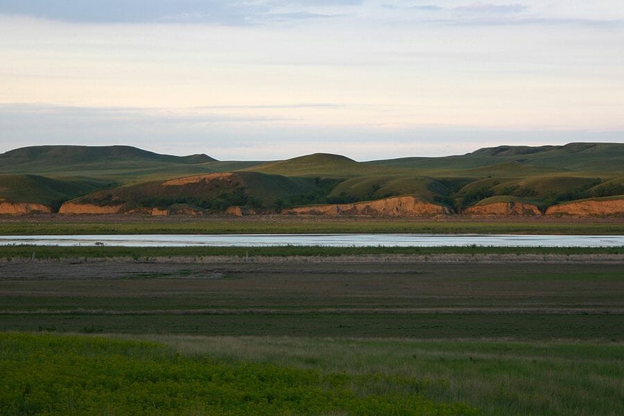 A stretch of the Cannonball River with mountains at the background