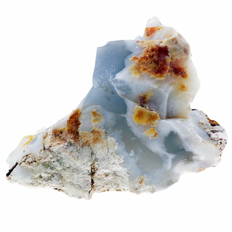 A rare mesmerizing chalcedony crystal with brown, white, and black inclusions