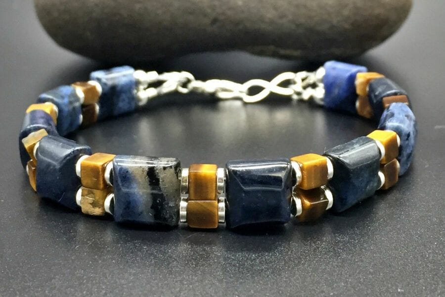 A luxurious dolomite beaded bracelet with blue, yellow, and silver colors