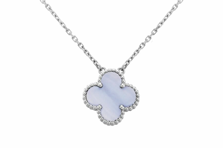 A timeless vintage alhambra chalcedony pendant with a studded border