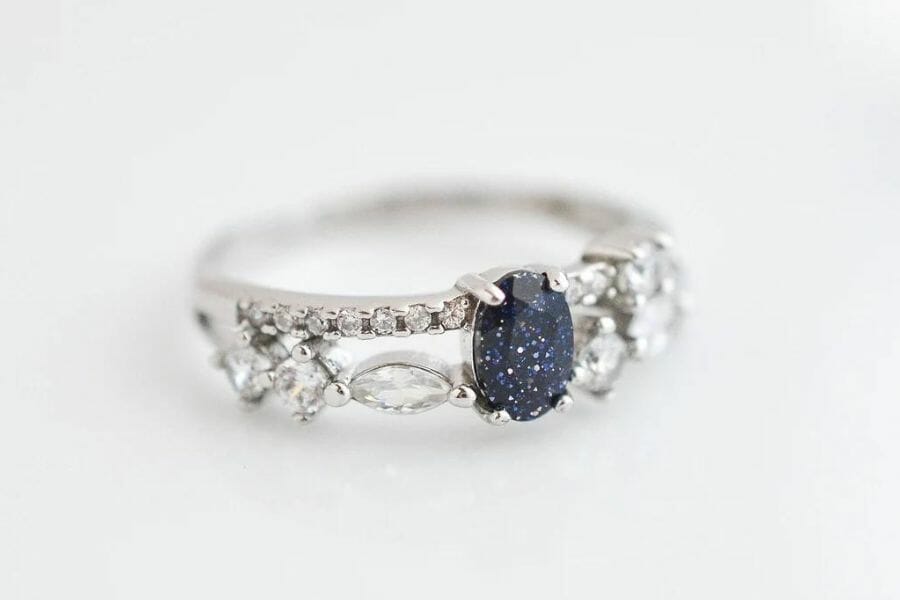 An elegant blue sandstone ring with diamond crystals surrounding it