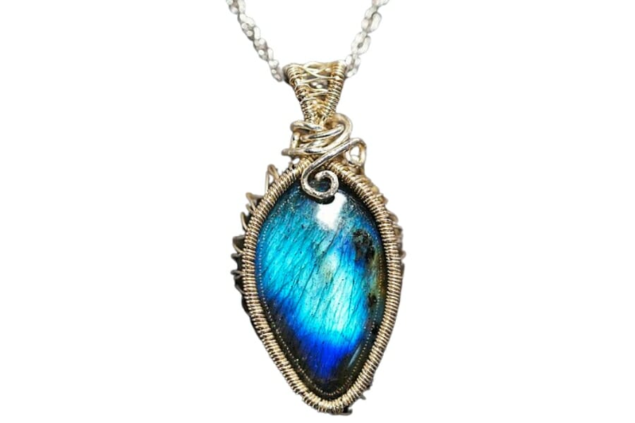 Stunning Feldspar gem with blue sheen adorning a pendant