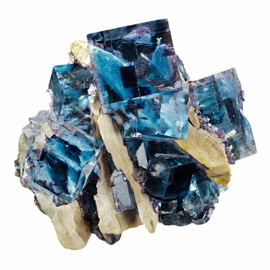 A unique and irregular shaped gorgeous fluorite with blue, purple, yellow, and white colors