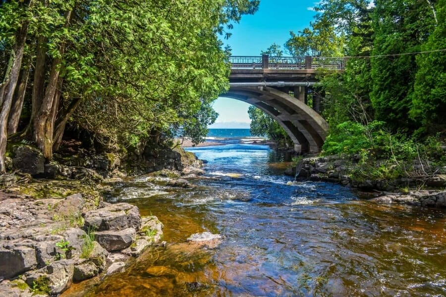 French River flowing under a bridge