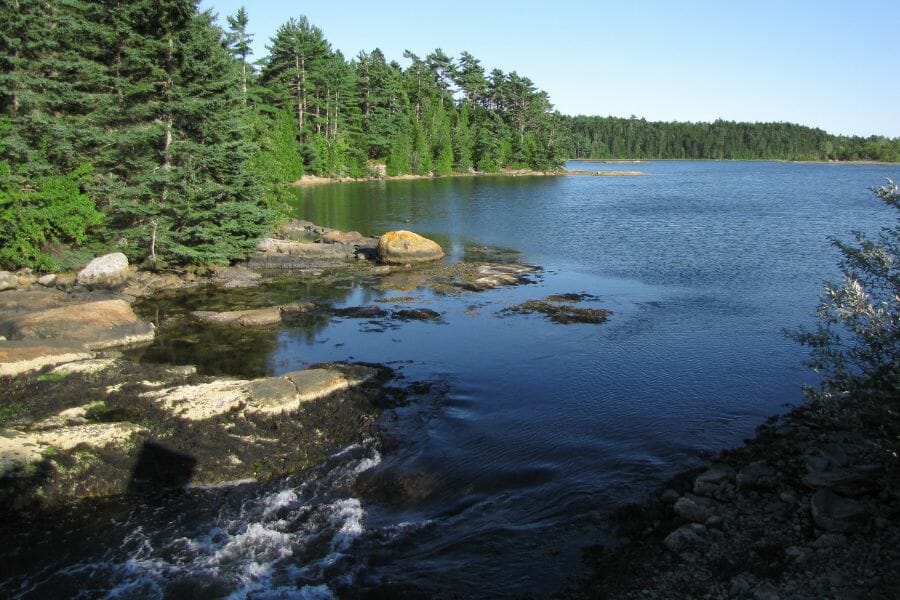 Serene and calm water flowing through Goose Falls Road where you can find different rock and mineral specimens