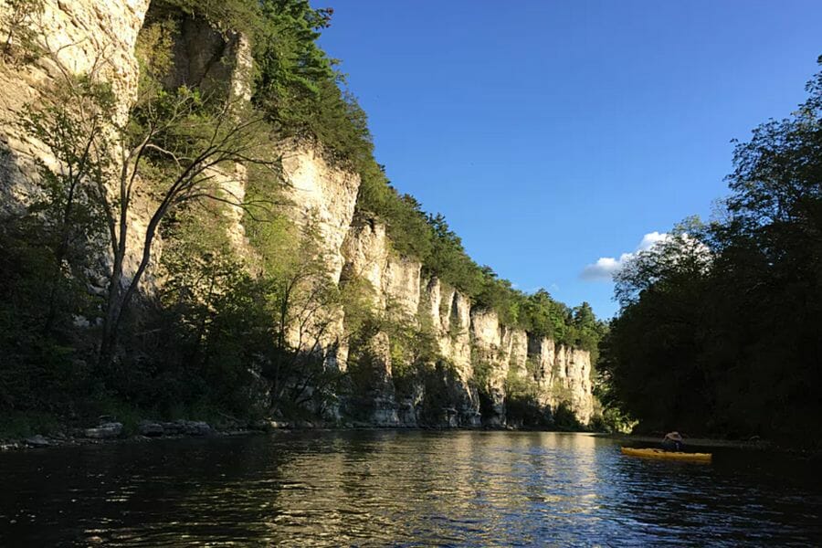 Beautiful scenic Iowa River with historic rock formations on its side