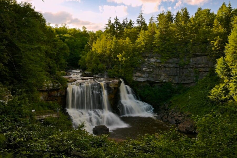 Stunning aerial view of one part of the Monongahela National Forest featuring a little waterfalls surrounded by greeneries