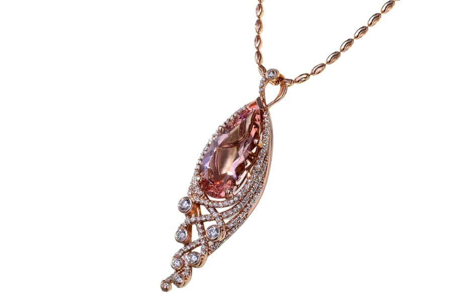 Pear-shaped pink Morganite set as pendant on a gold necklace