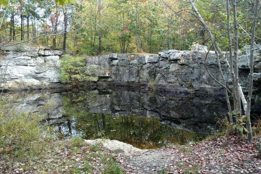 A nice area with rocks and lake at Mount Apatite where garnets can be located