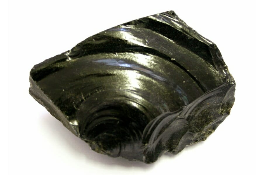 Shiny sample of Black Obsidian with a greenish sheen