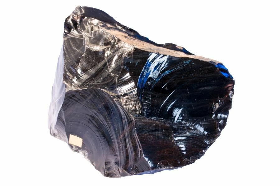 An elegant obsidian mineral with streaks of blue and white